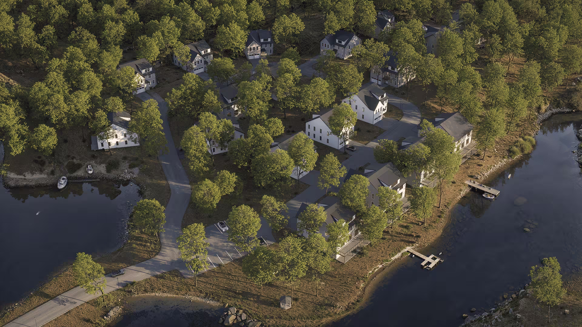 Aerial render of modern residential community surrounded by trees and lake shoreline